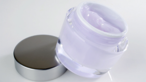 A jar of purple moisturizer